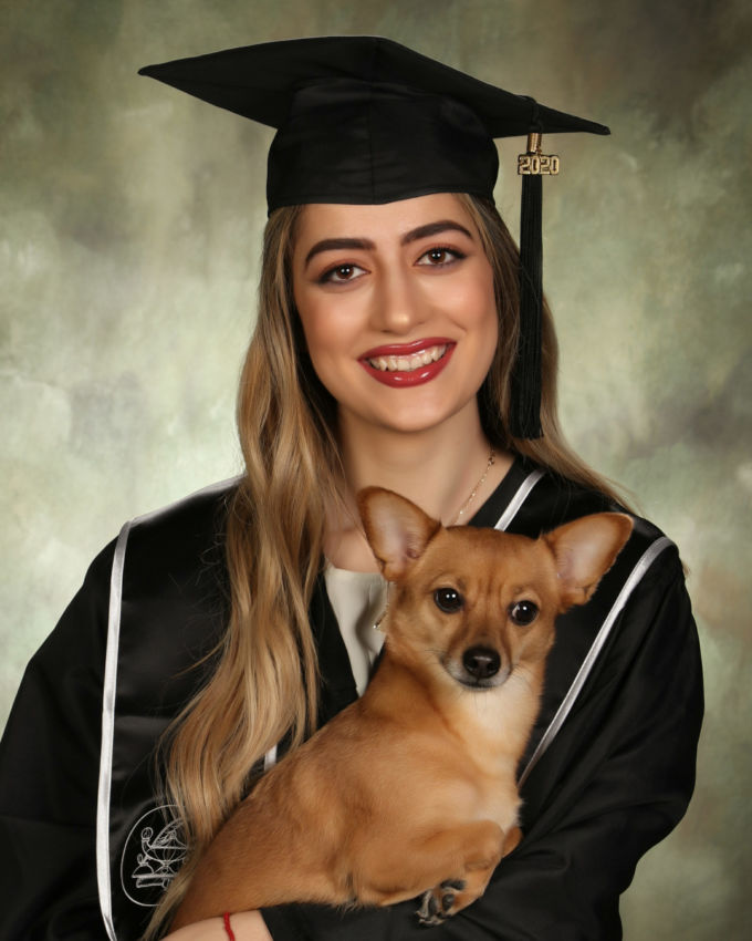 cap and gown portrait with dog